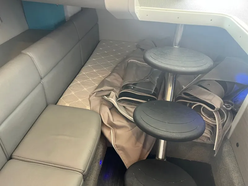 Slide: The Image of Interior of a 2019 Formula 350 Crossover Bowrider with gray upholstery and foldable seats. - 10