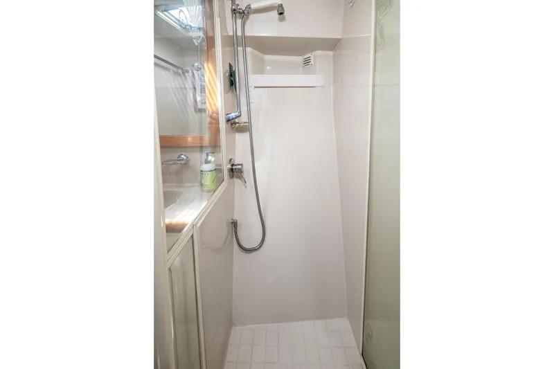 Slide: The Image of Shower area in 1999 Riviera 48 Convertible yacht, featuring modern fixtures and sleek design. - 50