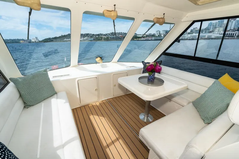 Slide: The Image of Luxurious interior of 1999 Riviera 48 Convertible yacht with scenic waterfront views. - 15
