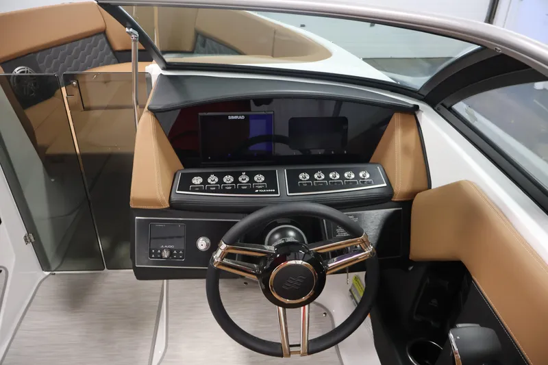 Slide: The Image of Interior view of 2026 Four Winns H4 boat dashboard with steering wheel and controls. - 17