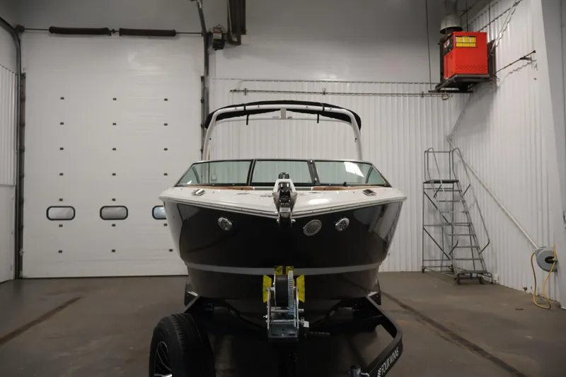 Slide: The Image of 2026 Four Winns H4 boat in indoor storage, front view. - 1