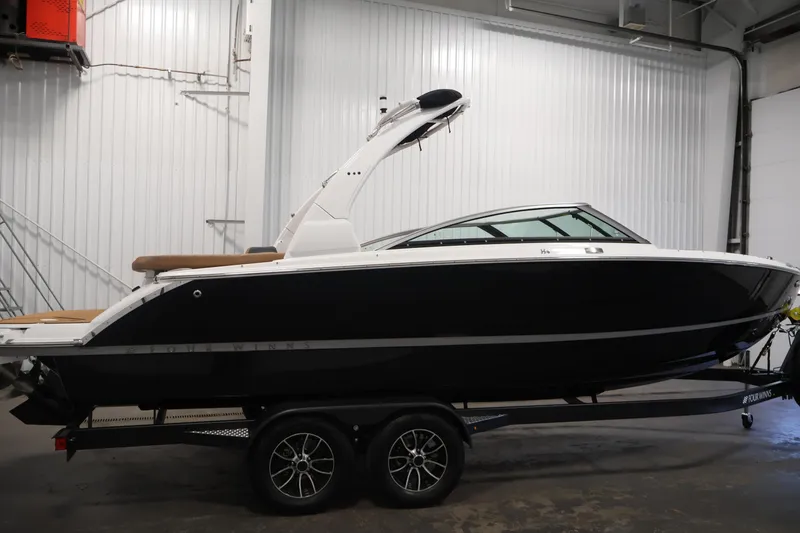 Slide: The Image of 2026 Four Winns H4 boat on trailer in indoor storage facility. - 3