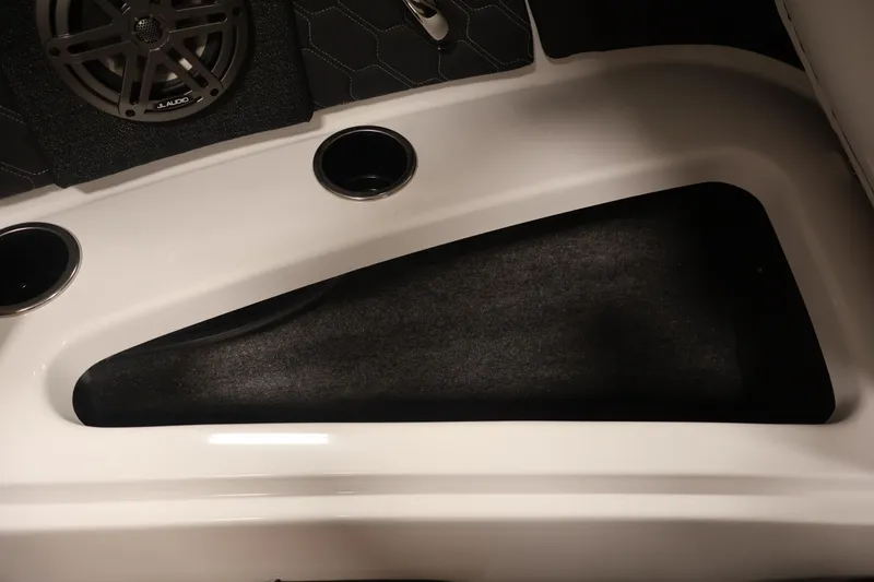 Slide: The Image of Interior of 2026 Four Winns H4 boat with speaker and cup holders. - 15