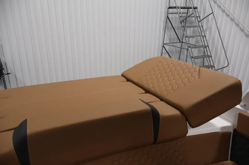 Slide: The Image of Luxurious tan seating on 2026 Four Winns H4 boat, featuring hexagonal stitching design. - 41