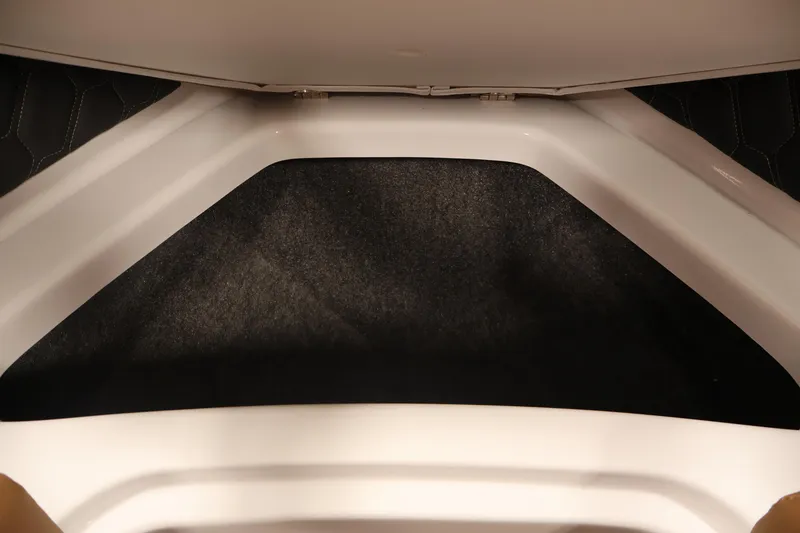 Slide: The Image of Interior view of 2026 Four Winns H4 boat storage compartment. - 12
