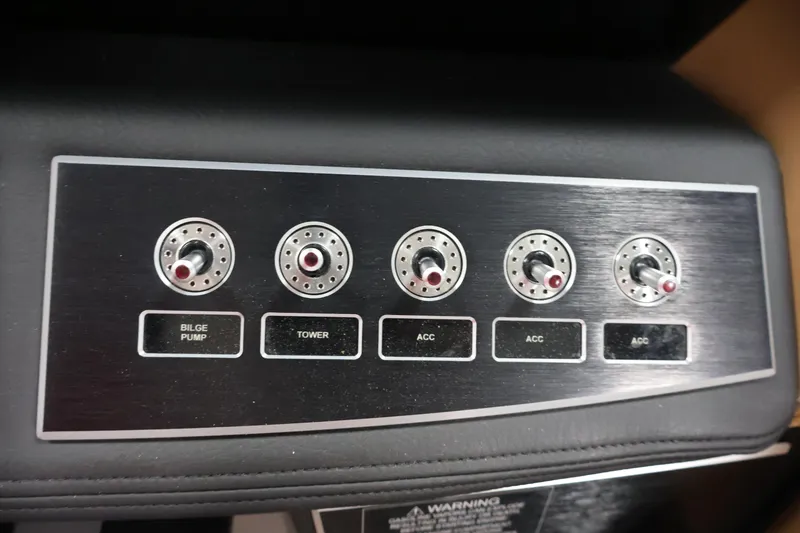 Slide: The Image of Control panel of 2026 Four Winns H4 boat with labeled switches. - 21