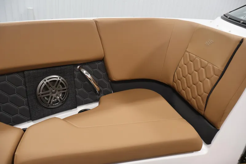 Slide: The Image of Luxurious tan seating with speaker detail in 2026 Four Winns H4 boat interior. - 14