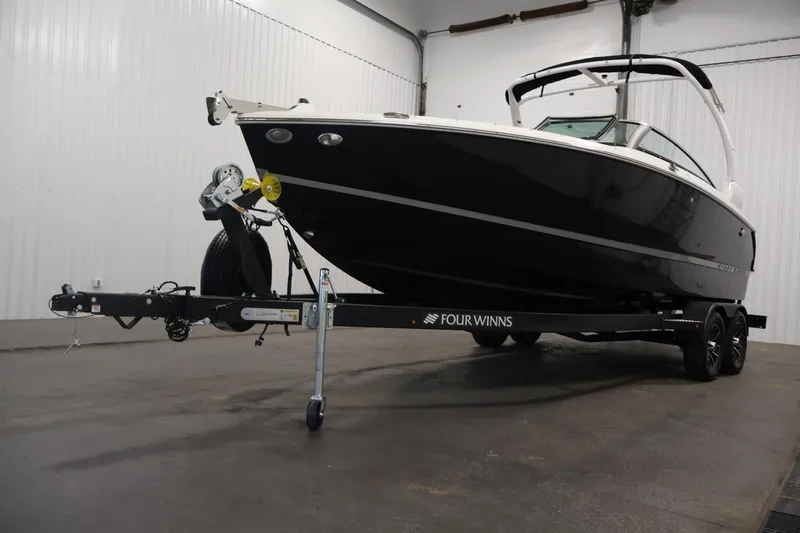 Slide: The Image of 2026 Four Winns H4 boat on trailer in indoor storage facility. - 55