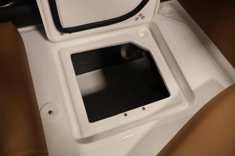 Slide: The Image of Open storage compartment on 2026 Four Winns H4 boat, featuring white interior design. - 37