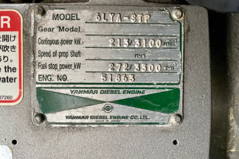 Slide: The Image of Yanmar diesel engine plate on a 2002 Mainship Pilot 34, model 6LYA-STP. - 49