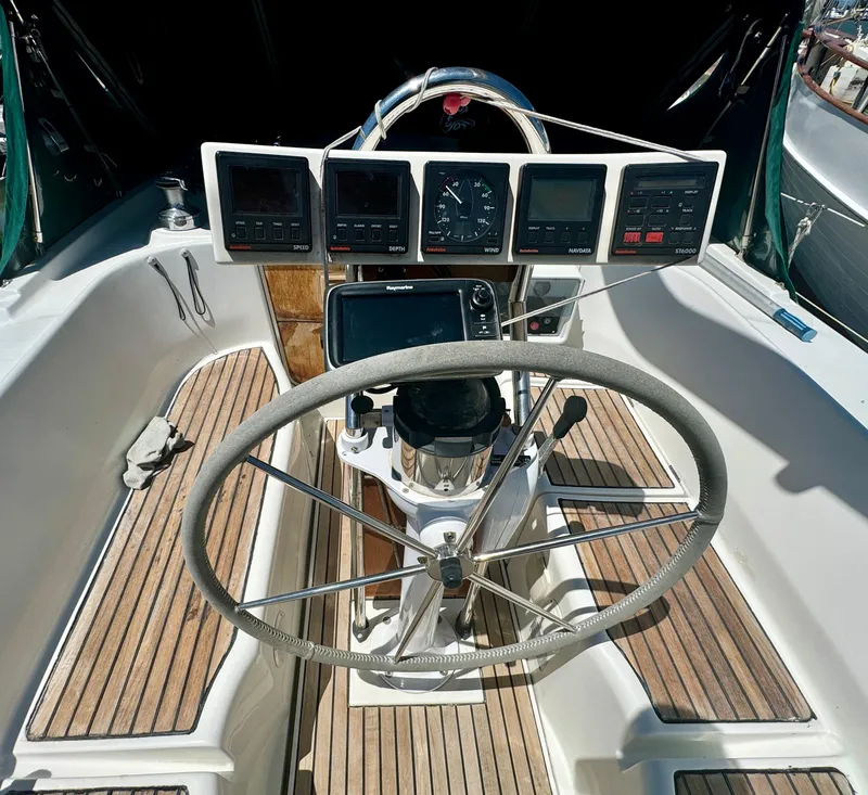 Slide: The Image of Steering wheel and instrument panel of 1996 Beneteau Oceanis 40 CC sailboat. - 4
