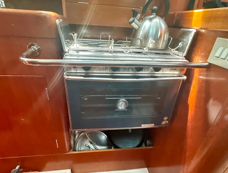 Slide: The Image of Galley stove and kettle in 1996 Beneteau Oceanis 40 CC yacht interior. - 14