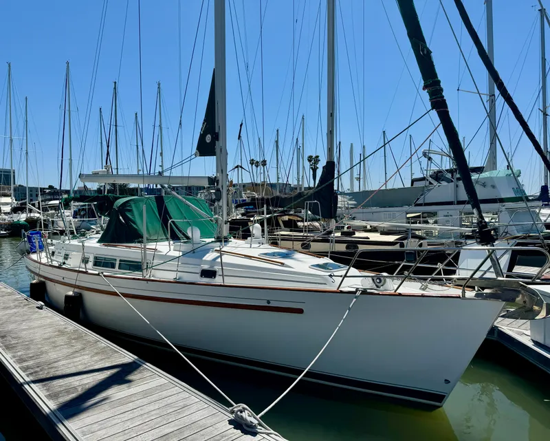Slide: The Image of 1996 Beneteau Oceanis 40 CC sailboat docked at marina under clear blue sky. - 31