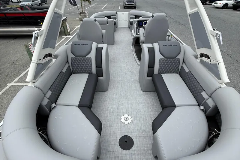 Slide: The Image of Luxurious interior of a 2027 Berkshire 25RFX STS pontoon boat with plush seating. - 11