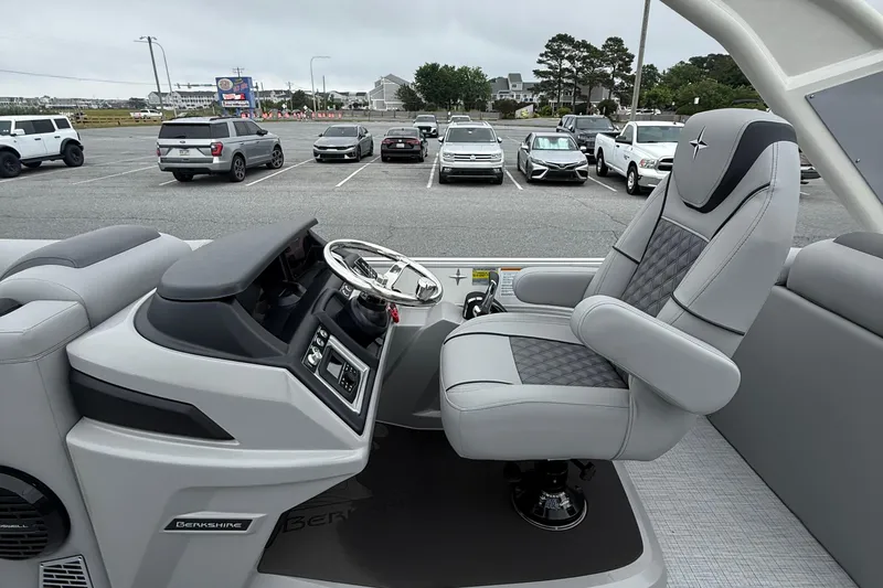 Slide: The Image of Interior of a 2027 Berkshire 25RFX STS boat with luxurious captain's chair and control panel. - 12