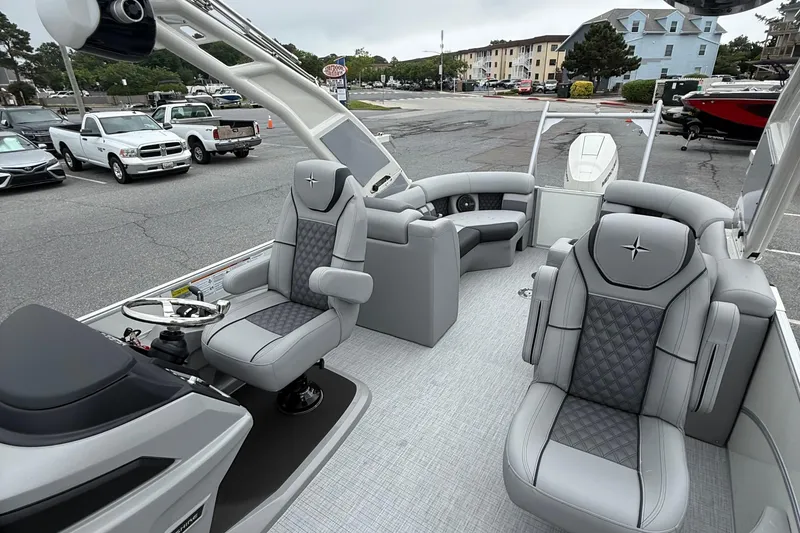 Slide: The Image of 2027 Berkshire 25RFX STS pontoon boat interior with luxurious gray seating and modern design. - 10