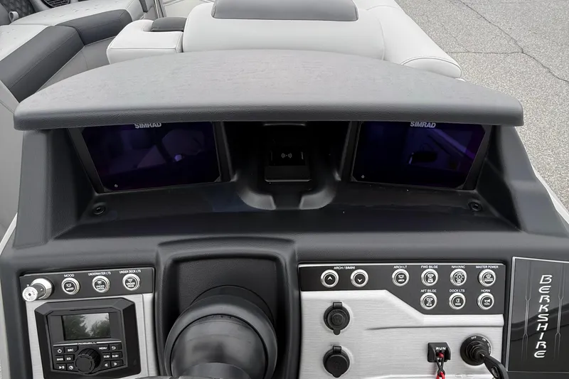 Slide: The Image of Dashboard of 2027 Berkshire 25RFX STS boat with Simrad displays and control panel. - 13