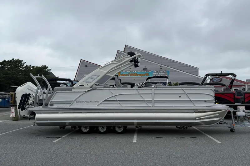The Image of 2027 Berkshire 25RFX STS pontoon boat parked outdoors on a cloudy day. - 1