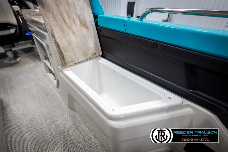 Slide: The Image of 2025 Avalon 2585 Excal VRBW boat interior storage compartment, open lid, modern design. - 39