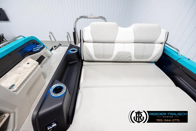 Slide: The Image of 2025 Avalon 2585 Excal VRBW boat interior with luxurious seating and cup holders. - 18
