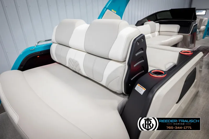 Slide: The Image of 2025 Avalon 2585 Excal VRBW boat interior with luxurious seating and cup holders. - 30