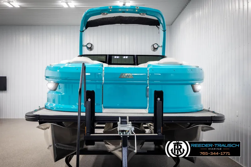 Slide: The Image of 2025 Avalon 2585 Excal VRBW pontoon boat in showroom, vibrant blue exterior. - 9