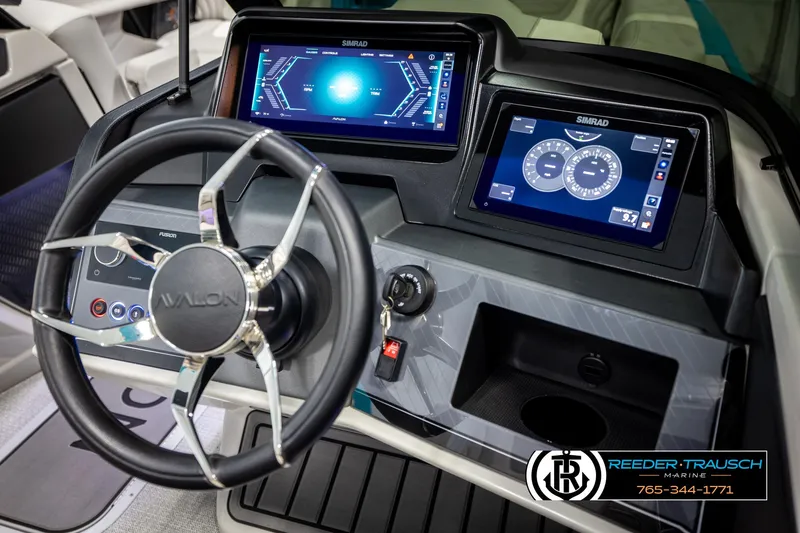 Slide: The Image of Steering console of 2025 Avalon 2585 Excal VRBW with digital displays and controls. - 41