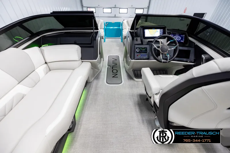 Slide: The Image of Interior of 2025 Avalon 2585 Excal VRBW boat with modern dashboard and seating. - 21