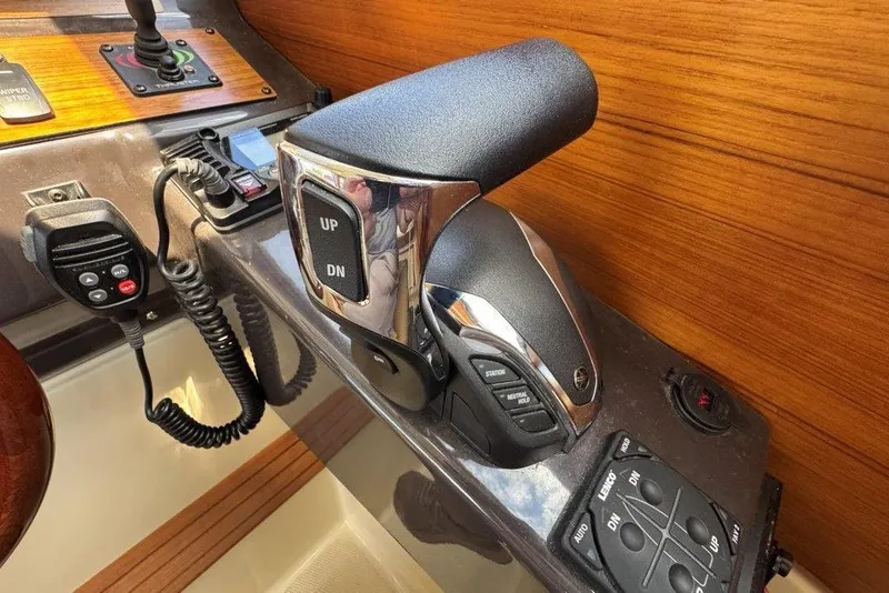 Slide: The Image of Control panel of a 2022 Ranger Tugs R-27 boat with throttle and communication devices. - 21