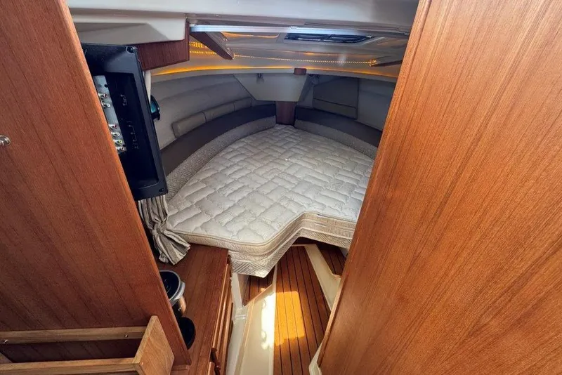 Slide: The Image of Interior cabin of 2022 Ranger Tugs R-27 with cozy bed and wooden finish. - 23