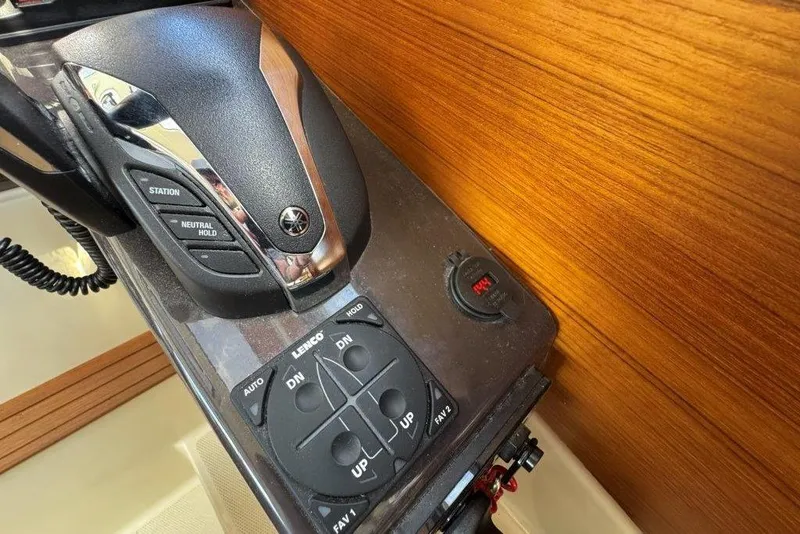 Slide: The Image of Control panel of a 2022 Ranger Tugs R-27 boat with Yamaha throttle and trim tabs. - 22