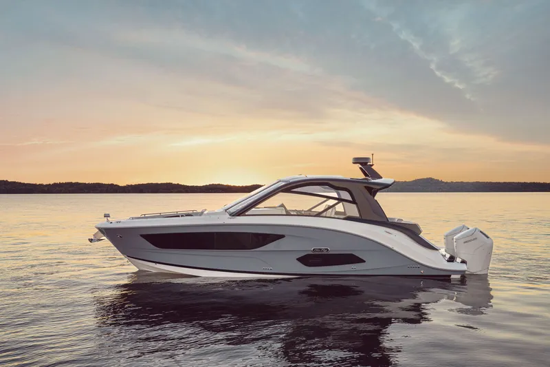 Slide: The Image of Sea Ray Sundancer 370 Outboard 2026 on calm water at sunset. - 26