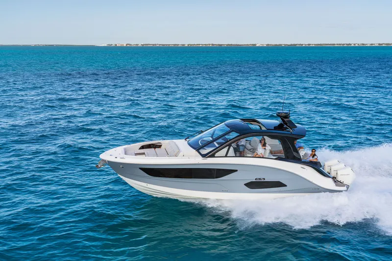 Slide: The Image of 2026 Sea Ray Sundancer 370 Outboard cruising on open water. - 0