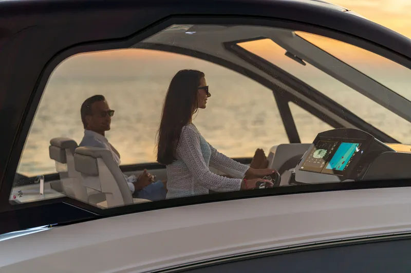Slide: The Image of Two people relax on a modern yacht at sunset. - 19