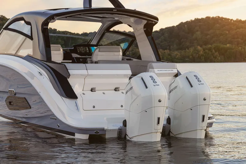 Slide: The Image of The image shows a 2026 Sea Ray Sundancer 370 Outboard with two outboard engines in the water. - 6
