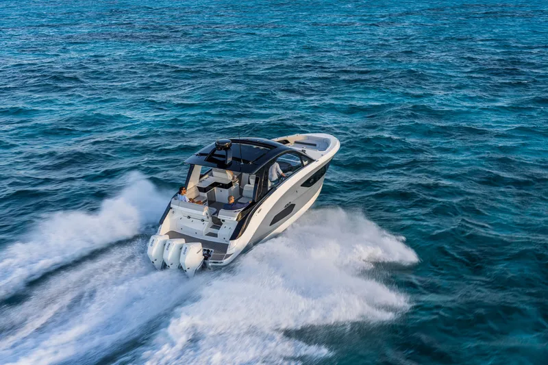 Slide: The Image of Sea Ray Sundancer 370 Outboard 2026 cruising on open water. - 16