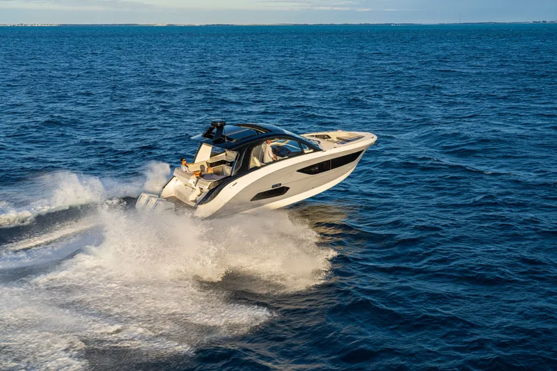 Slide: The Image of 2026 Sea Ray Sundancer 370 Outboard cruising on open water. - 32