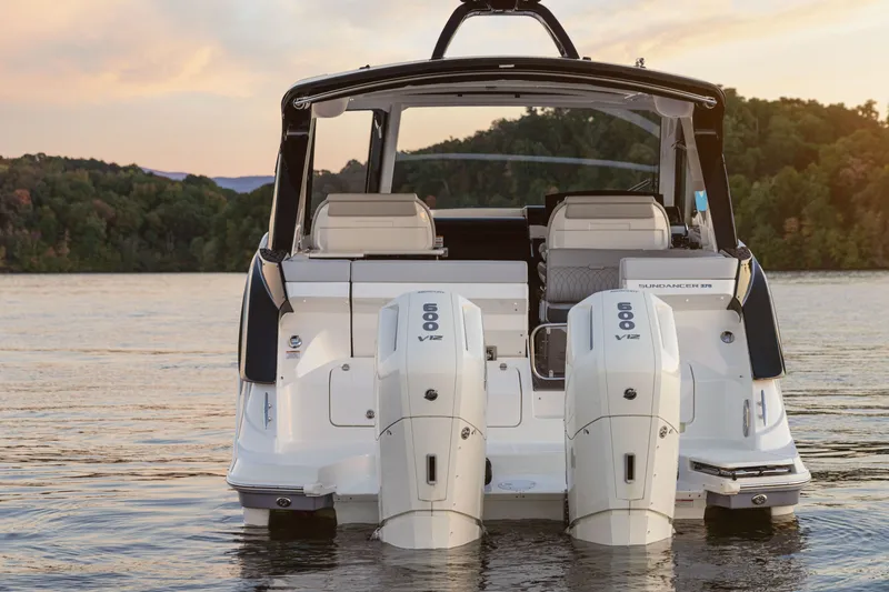 Slide: The Image of Rear view of the Sea Ray Sundancer 370 Outboard with two powerful outboard engines in the water. - 35