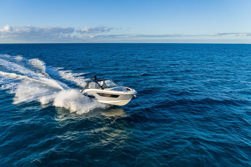 Slide: The Image of A 2026 Sea Ray Sundancer 370 Outboard speeds across the open sea. - 28
