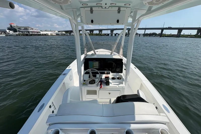Slide: The Image of The image shows a 2017 Sea Hunt BX 25 BR boat on the water. - 15