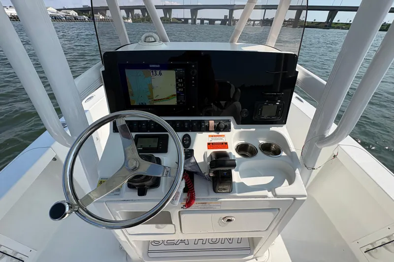 Slide: The Image of 2017 Sea Hunt BX 25 BR boat dashboard with steering wheel and navigation system. - 5