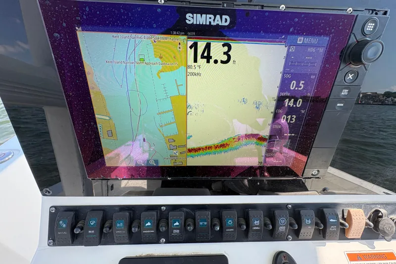 Slide: The Image of Simrad navigation display on 2017 Sea Hunt BX 25 BR boat dashboard. - 16