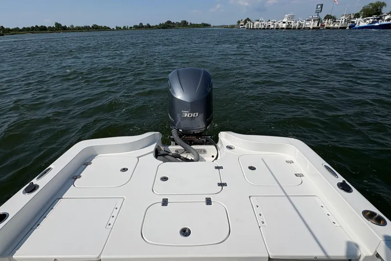 Slide: The Image of 2017 Sea Hunt BX 25 BR boat with 300 horsepower engine on open water. - 4