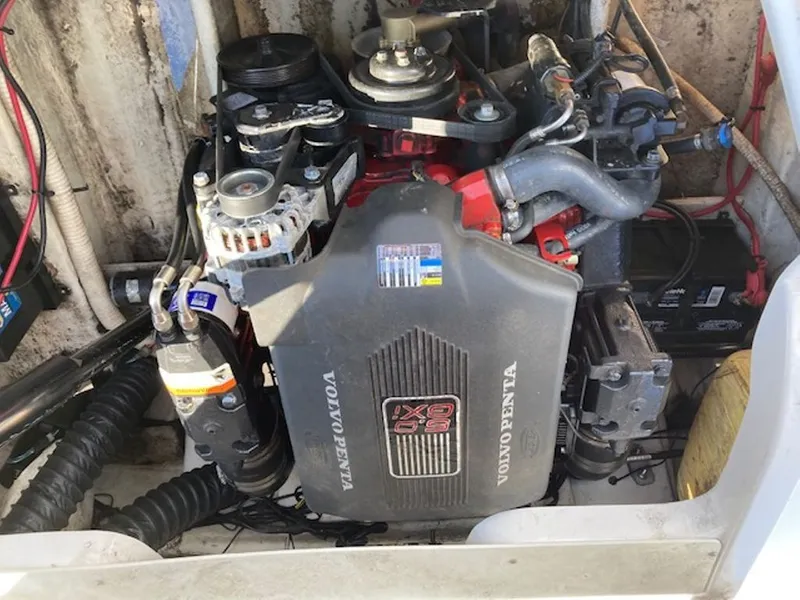 Slide: The Image of A Volvo Penta engine in a boat, surrounded by cables and hoses. - 9
