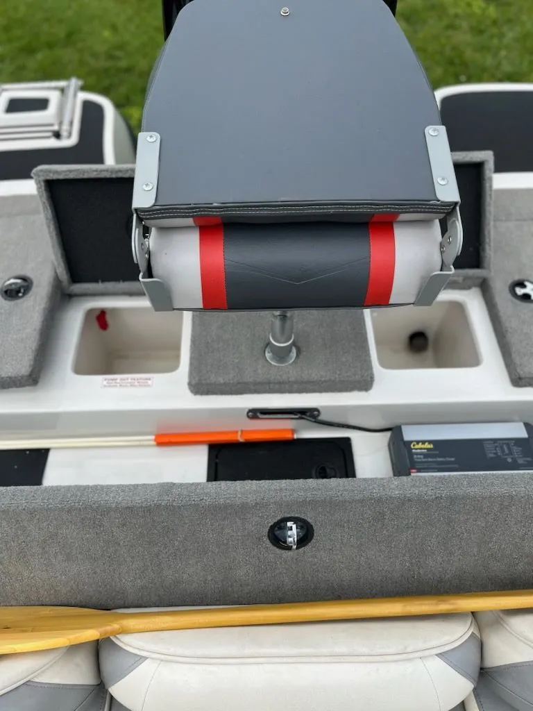 Slide: The Image of The image shows the interior of a 2015 Nitro Z-7 Sport boat with storage and accessories. - 13