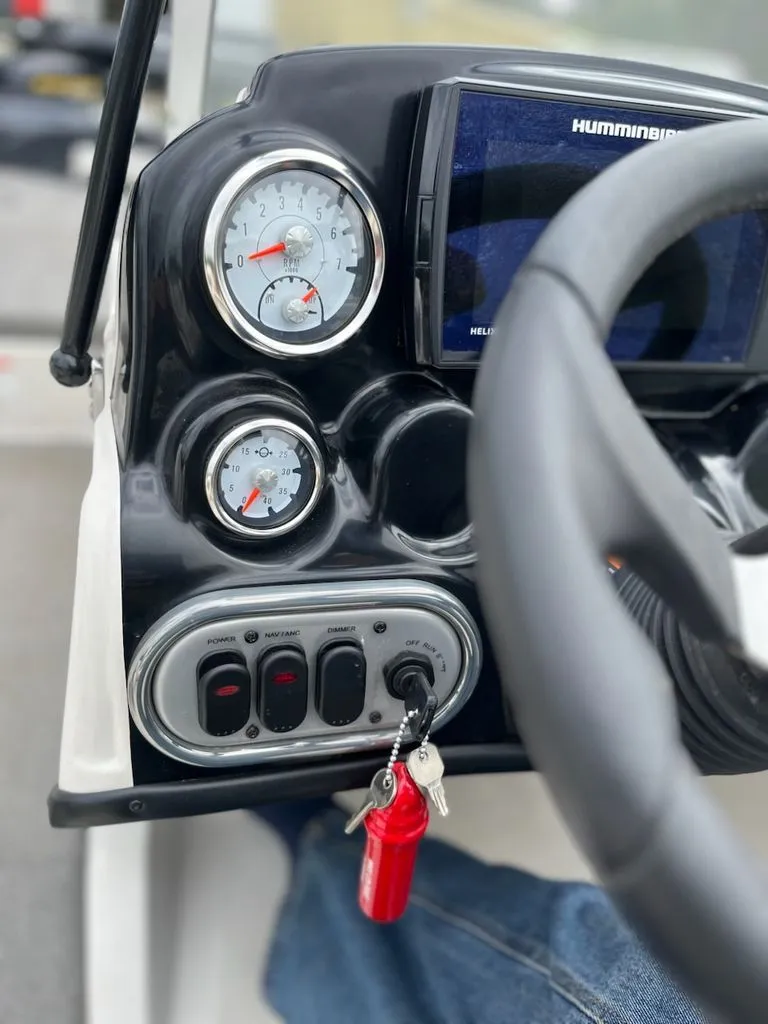 Slide: The Image of Dashboard of a Nitro Z-7 Sport boat with gauges and switches. - 3