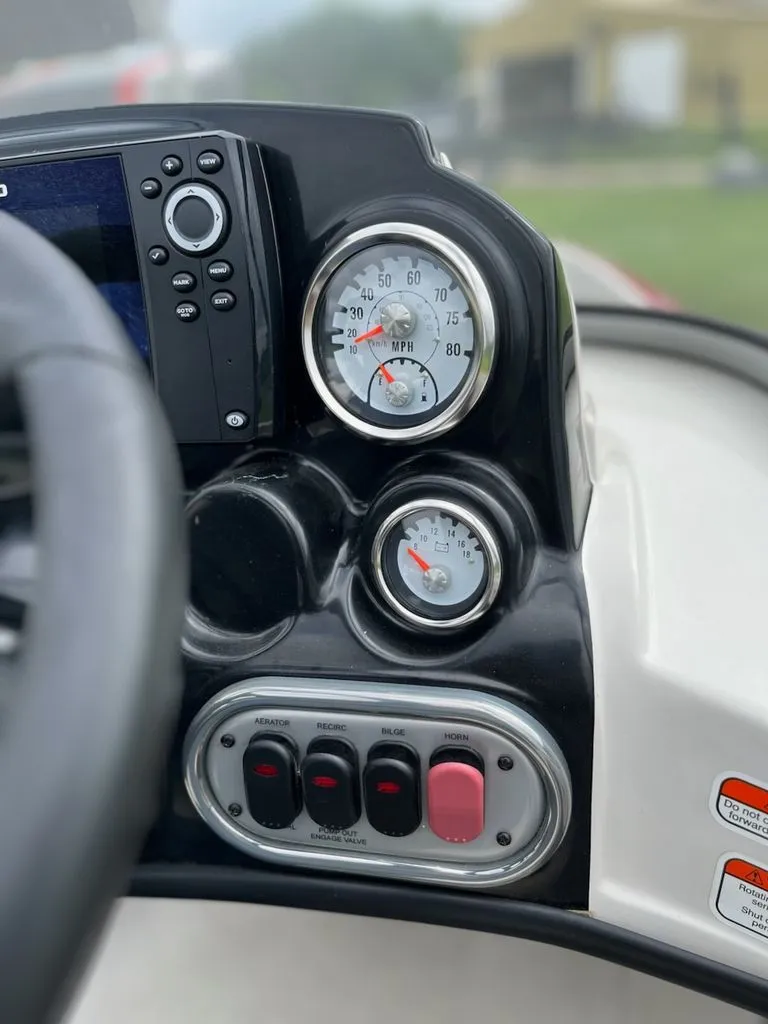 Slide: The Image of Close-up of a Nitro Z-7 Sport boat dashboard with speedometer and switches. - 5