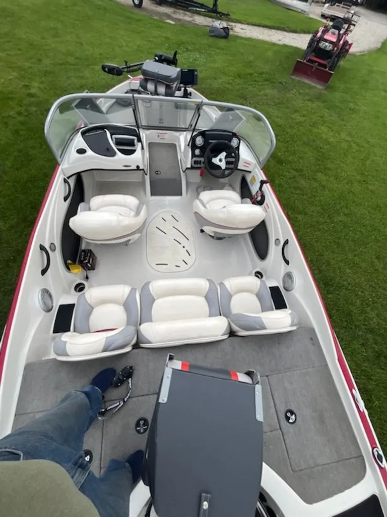 Slide: The Image of Interior view of a 2015 Nitro Z-7 Sport with four seats and a steering console. - 10