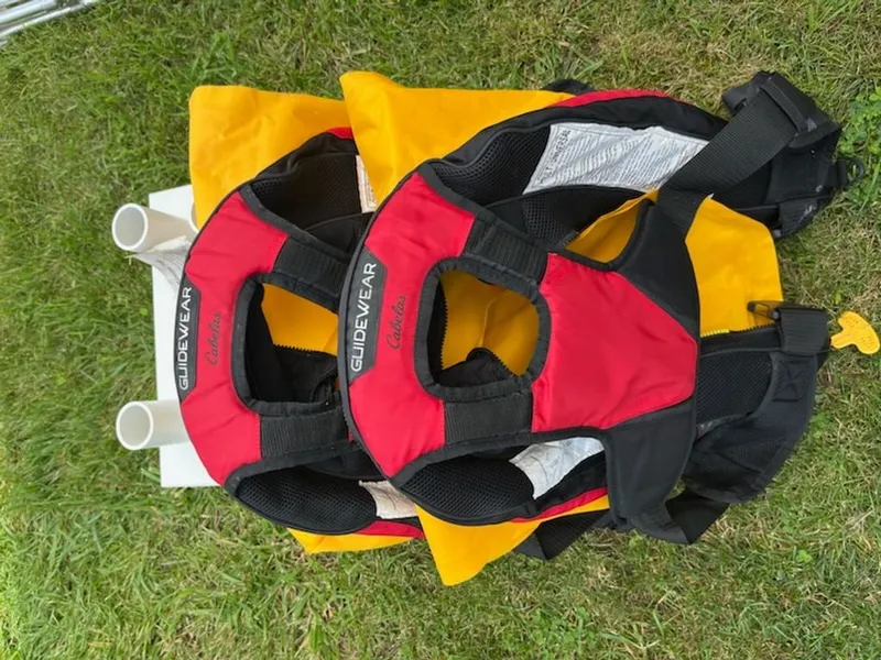 Slide: The Image of Two life jackets are lying on the grass. - 18