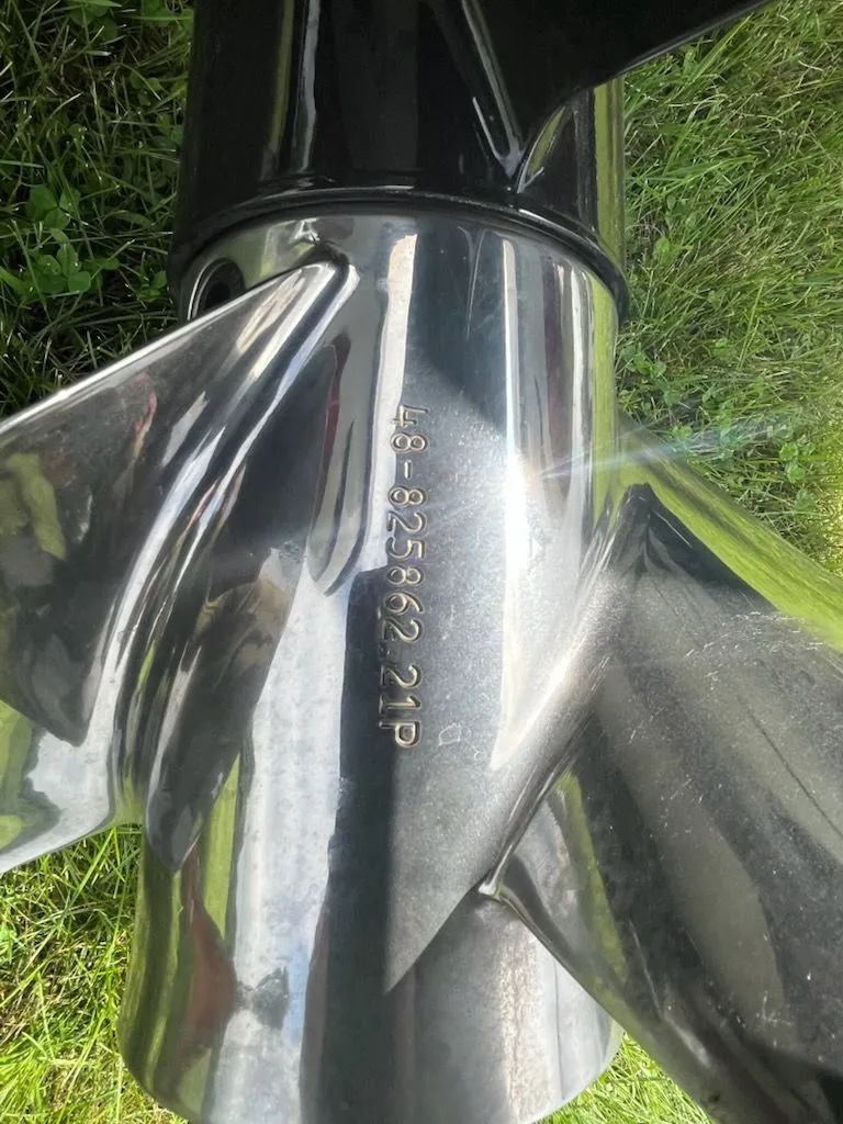 Slide: The Image of Close-up of a shiny boat propeller on grass. - 23